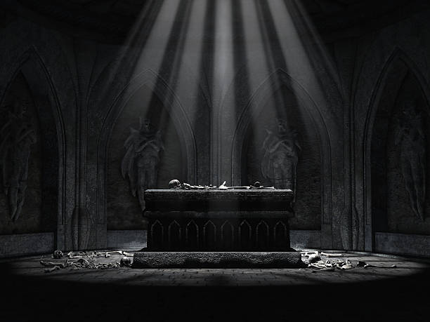A black marble Altar with golden lettering on the top edges. It is located within an old catacombs.